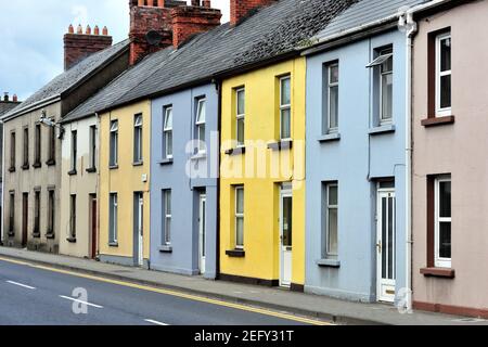 Kilmallock, County Limerick, Ireland. Color provides variety for a block of residences on Sarsfield Street in the community of Kilmallock. Stock Photo