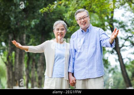 Portrait of happy old couple Open arms Stock Photo