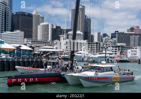 Auckland, New Zealand, 18 February, 2021 -  Luna Rossa Prada Pirelli crew leave their dock for training on the Waitemata Harbour wearing mandatory face coverings for the next Prada Cup Final race which has been postponed. The next racing is expected at the weekend under Level 2 Covid -19 lockdown conditions limiting spectators gathering to watch the racing.. Credit: Rob Taggart/Alamy Live News Stock Photo
