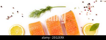 Fresh salmon panorama with herbs and seasoning, top shot on a white background Stock Photo