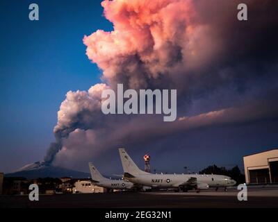 Sicily, Italy. 16th Feb, 2021. Handout photo of Mt. Etna lets off some steam in the background of P-8A Poseidon maritime patrol aircraft assigned to the 'Grey Knights' of Patrol Squadron (VP) 46. Mount Etna, Europe's most active volcano, leaps into action, seen from Sigonella Italy, Tuesday February 16, 201. Italy's National Institute for Geophysics and Volcanology said the eruption does not pose any threat to surrounding communities but authorities suspended flights from Catania international airport. U.S. Navy photo by Mass Communication Specialist 2nd Class Austin Ingram via ABACAPRESS.COM  Stock Photo