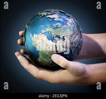 Hands holding a globe against dark background. 3D illustration. Stock Photo