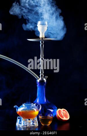 Modern shisha and glass teapot on black background Stock Photo - Alamy