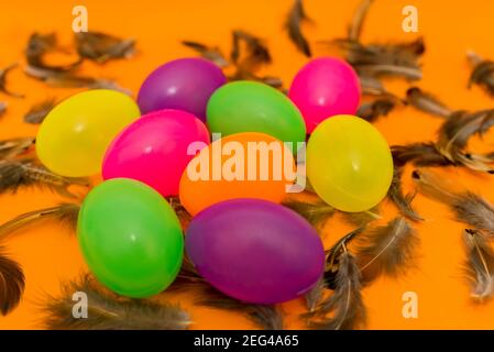 Easter easter colorful eggs and feathers spring colors eggs,spring season holidays concept. Stock Photo