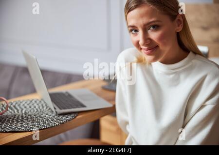 Youthful lady looking kindly at the camera Stock Photo