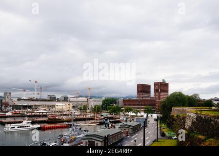 Oslo, Norway - August 10, 2019: View of the port of Aker Brygge with City Hall on background from Akershus Fortress Stock Photo