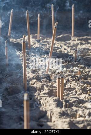 Smoke from burning incense sticks in a large caldron koro burner or censer at a Buddhist temple in Kyoto, Japan. Stock Photo