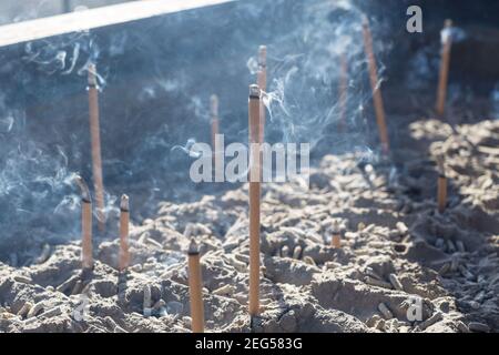 Smoke from burning incense sticks in a large caldron koro burner or censer at a Buddhist temple in Kyoto, Japan. Stock Photo