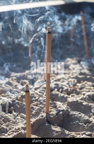 Smoke from burning incense sticks in a large caldron koro burner or censer at a Buddhist temple in Kyoto, Japan. Stock Photo