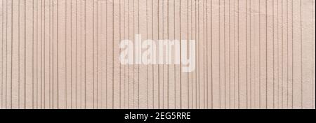 Detail of a beige wall with painted vertical lines Stock Photo