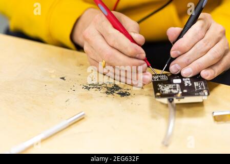Moscow. Russia. November 2019. The Assembly of the sensors on the chip. Classes at the school of technical creativity Stock Photo