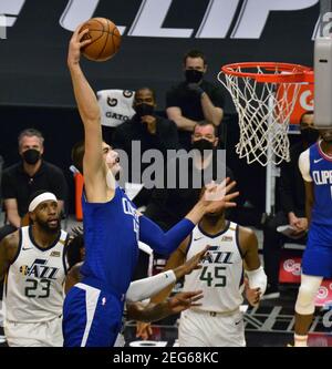 Los Angeles, United States. 18th Feb, 2021. Los Angeles Clippers' center Ivica Zubac jams past Utah Jazz defenders during the first half at Staples Center in Los Angeles on Wednesday, February 17, 2021. The Jazz defeated the Clippers 114-96. Photo by Jim Ruymen/UPI Credit: UPI/Alamy Live News Stock Photo