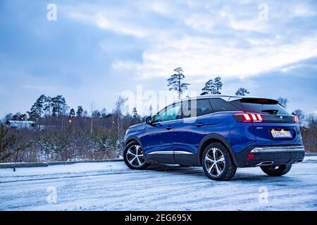 MOSCOW, RUSSIA - MARCH 15, 2020: Blue SUV Peugeot 3008 on on winter landscape. Stock Photo