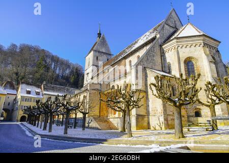 Street view of Saint Ursanne collegiate church and its abbey in charming medieval town Saint Ursanne, Canton Jura, Switzerland. Stock Photo