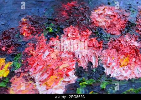 Different bright colors of oil paints are mixed close-up Stock Photo