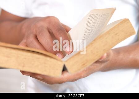 close up of person hand reading a book Stock Photo
