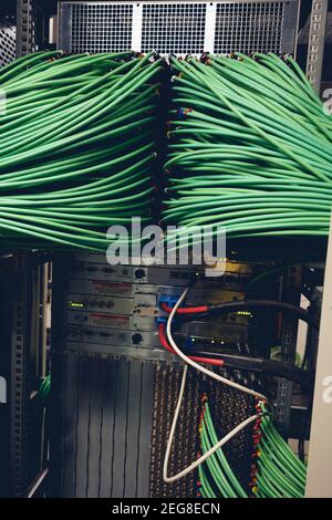Close up view of internet equipment and cables in the server room. Broadcast system room. Stock Photo