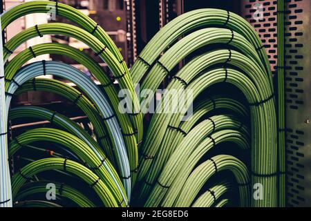 Close up view of internet equipment and cables in the server room. Broadcast system room. Stock Photo
