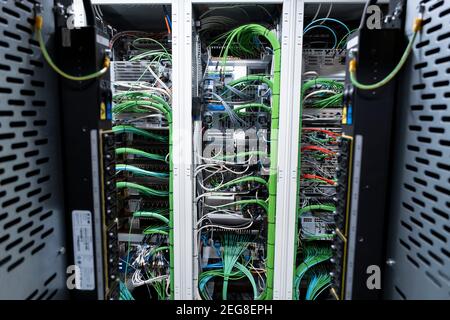 Close up view of internet equipment and cables in the server room. Broadcast system room. Stock Photo