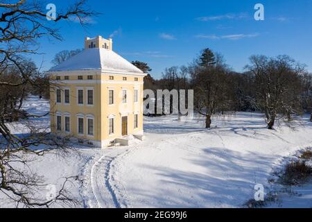 11 February 2021, Saxony-Anhalt, Wörlitz: Luisium Palace stands in the winter garden kingdom of Dessau-Wörlitz. Once built as a summer domicile, the castles in the historic Dessau-Wörlitz Garden Kingdom are traditionally closed in winter. The parks are open, but it is forbidden to walk on the ice surfaces on the waterways, as is ice skating. The Dessau-Wörlitz Garden Realm has been a Unesco World Heritage Site since 2000. (Aerial view with drone) Photo: Jan Woitas/dpa-Zentralbild/ZB Stock Photo