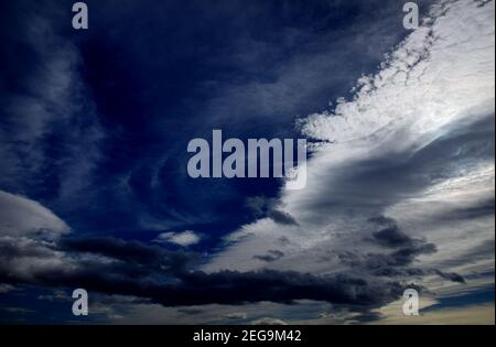 Sky with different types of clouds including a band of so called mackerel sky, indicator of a weather change Stock Photo