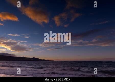 Beautiful sunset over Las Canteras beach in Las Palmas de Gran Canaria Stock Photo