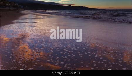 Beautiful sunset over Las Canteras beach in Las Palmas de Gran Canaria Stock Photo