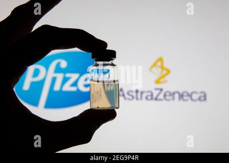 OXFORD, UK - February 2020: Pfizer and Astraeneca logos with covid-19 vaccine Stock Photo