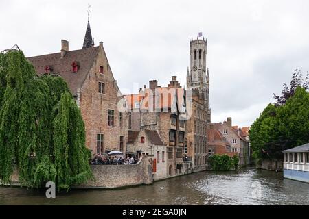 Medieval buildings on the Dijver canal with the Belfry bell tower seen from Rozenhoedkaai in Bruges, Belgium Stock Photo