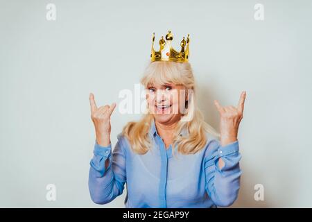 Beautiful senior woman at home and looking at camera smiling - Pretty adult over 60 years old portrait Stock Photo