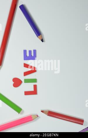 LIVE wording and Colour Pencils Isolated With White Background Stock ...