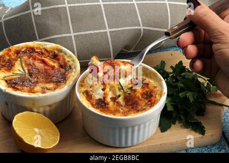 Delicious cod and cheese soup, creamy and warming, served in deep bowl ...