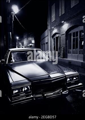 old-cadillac-at-night-2egbd57.jpg