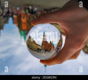 Wroclaw July 19 2019 Wroclaw Town hall tower reflected in crystal glassy lensball Stock Photo