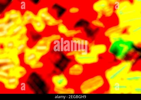 Brightly coloured red and and yellow abstract background formed by blurred lights