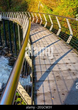 The Millennium Walkway public footbridge in the River Goyt gorge at The Torrs in New Mills High Peak Derbyshire England UK which opened in 1999. Stock Photo