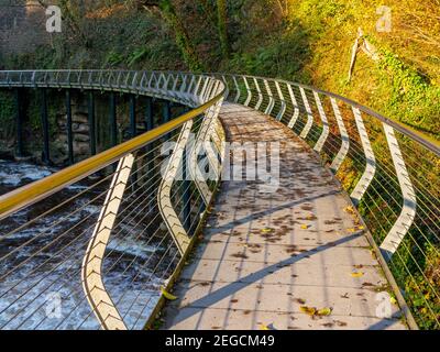 The Millennium Walkway public footbridge in the River Goyt gorge at The Torrs in New Mills High Peak Derbyshire England UK which opened in 1999. Stock Photo