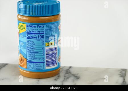 Peanut butter nutrition facts, ingredients and calories label on a jar of skippy peanut butter Stock Photo