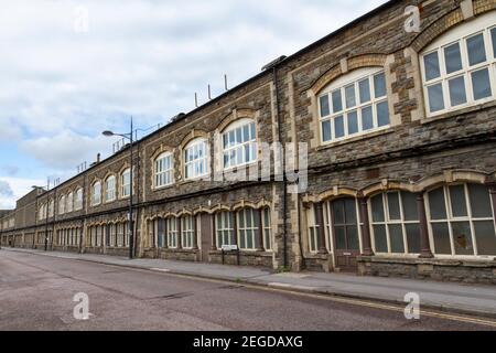 General view of the facade of the old GWR Carriage Works along London Street in Railway Village, Swindon, Wiltshire, UK. Stock Photo