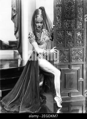 MARLENE DIETRICH with Gold Painted Legs in KISMET 1944 director WILLIAM DIETERLE play Edward Knoblock screenplay John Meehan hair styles Sydney Guilaroff costume supervisor Irene Metro Goldwyn Mayer Stock Photo