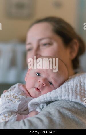 Three month old baby with mother Stock Photo