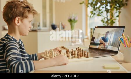 Teenage boy learning to play chess online with tablet computer. Online  education, remote distance learning, entertainment at home Stock Photo -  Alamy