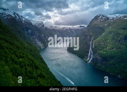 Seven sisters waterfall in Norway. Dramatic sky in Norvegian fjords.