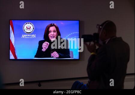 United States Vice President Kamala Harris is seen on a screen as she meets with women leader in Congress and advocacy organizations on the American Rescue Plan, during a virtual roundtable on the American Rescue Plan, at the Eisenhower Executive Office Building in Washington, DC on Thursday, February 18, 2021. The Rescue Plan includes direct payments to those in need, money to help reopen schools and extended unemployment benefits.Credit: Kevin Dietsch/Pool via CNP /MediaPunch Stock Photo