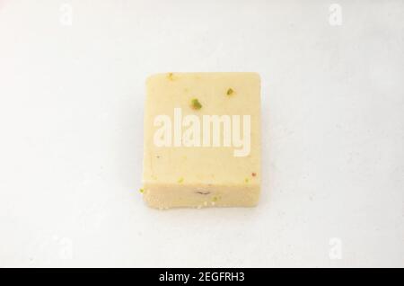 Pouring condensed milk isolated on white background Stock Photo - Alamy