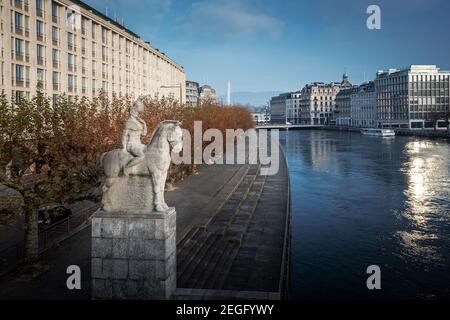 Rhone River and Aigle de Geneve Statue - Geneva, Switzerland Stock Photo