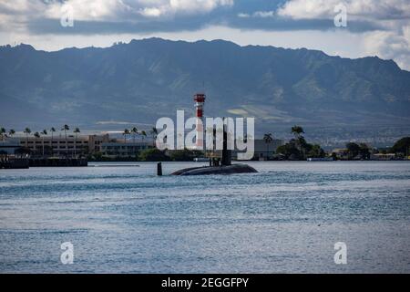 The U.S. Navy nuclear-power Los Angeles-class fast-attack submarine USS Springfield departs Joint Base Pearl Harbor-Hickam following a scheduled deployment February 12, 2021 in Honolulu, Hawaii. Stock Photo