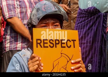 A girl seen crying while holding a placard saying, Respect, at the court building.Demonstrators gathered at the court hearing and demanded the release of the detained Mandalay Chief Minister, Dr. Zaw Myint Maung who was charged under section 505 (B) at Aung Myay Tharzan Township court following a lawsuit filed after a statement was issued by the National League for Democracy (NLD) central executive committee on February 1st, according to the court official. The Prime Minister has been detained since February 1st and was arraigned on video conferencing court, according to the prosecutors. Stock Photo