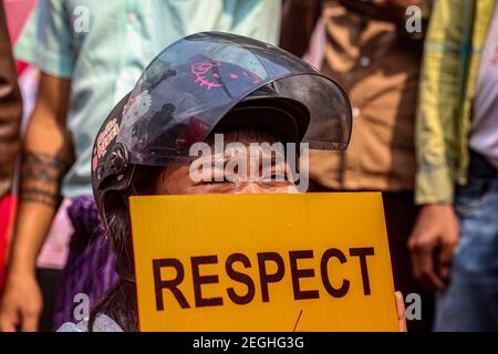 A girl seen crying while holding a placard saying, Respect, at the court building.Demonstrators gathered at the court hearing and demanded the release of the detained Mandalay Chief Minister, Dr. Zaw Myint Maung who was charged under section 505 (B) at Aung Myay Tharzan Township court following a lawsuit filed after a statement was issued by the National League for Democracy (NLD) central executive committee on February 1st, according to the court official. The Prime Minister has been detained since February 1st and was arraigned on video conferencing court, according to the prosecutors. Stock Photo