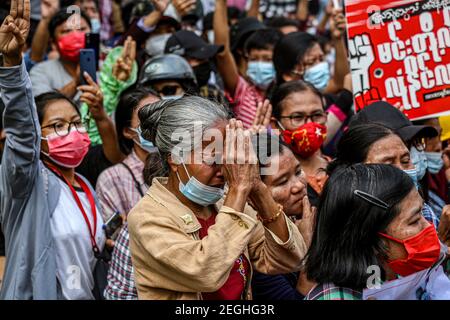 An elderly woman in grief at the court building.Demonstrators gathered at the court hearing and demanded the release of the detained Mandalay Chief Minister, Dr. Zaw Myint Maung who was charged under section 505 (B) at Aung Myay Tharzan Township court following a lawsuit filed after a statement was issued by the National League for Democracy (NLD) central executive committee on February 1st, according to the court official. The Prime Minister has been detained since February 1st and was arraigned on video conferencing court, according to the prosecutors. Stock Photo